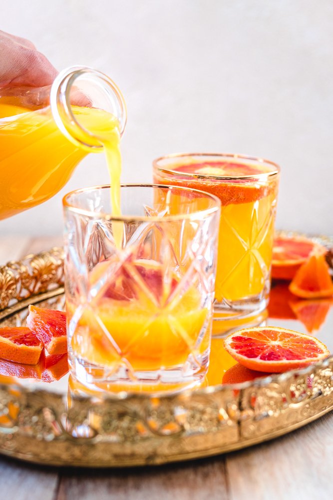 https://twospoons.ca/wp-content/uploads/2020/03/best-mimosa-recipe-easy-cocktail-drink-simple-2-ingredients-for-brunch-birthday-easter-with-prosecco-8.jpg